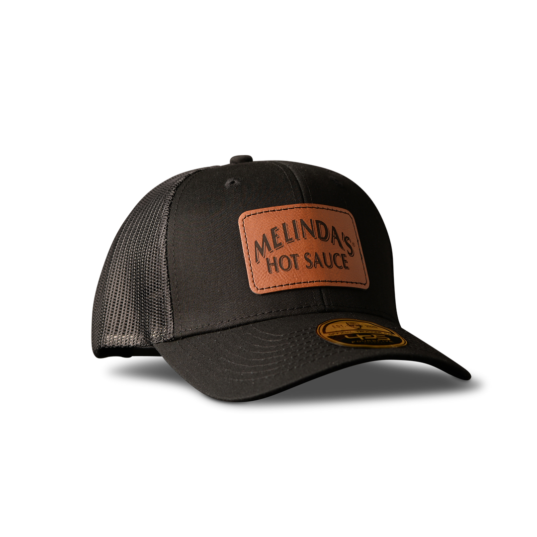 Melinda’s Black Snapback Trucker Hat