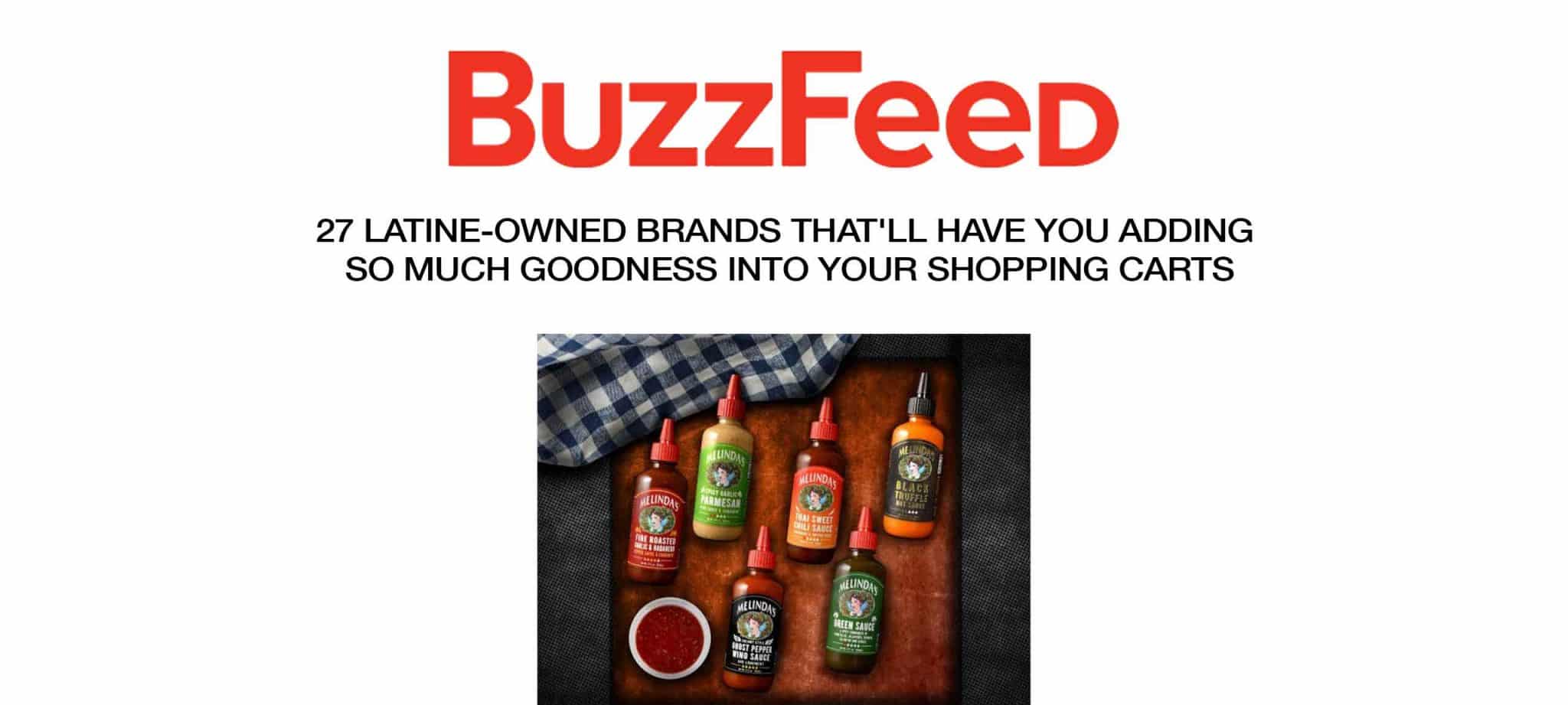 Various colorful hot sauce bottles from Latine-owned brands arranged on a wooden cutting board