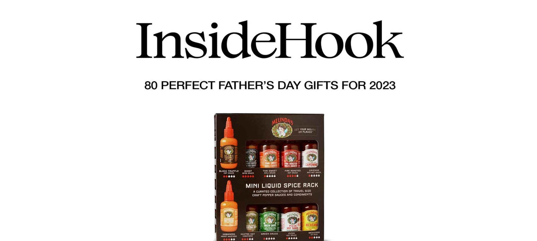 Melinda's Mini Liquid Spice Rack gift set with 10 small hot sauce bottles and condiments arranged in black packaging