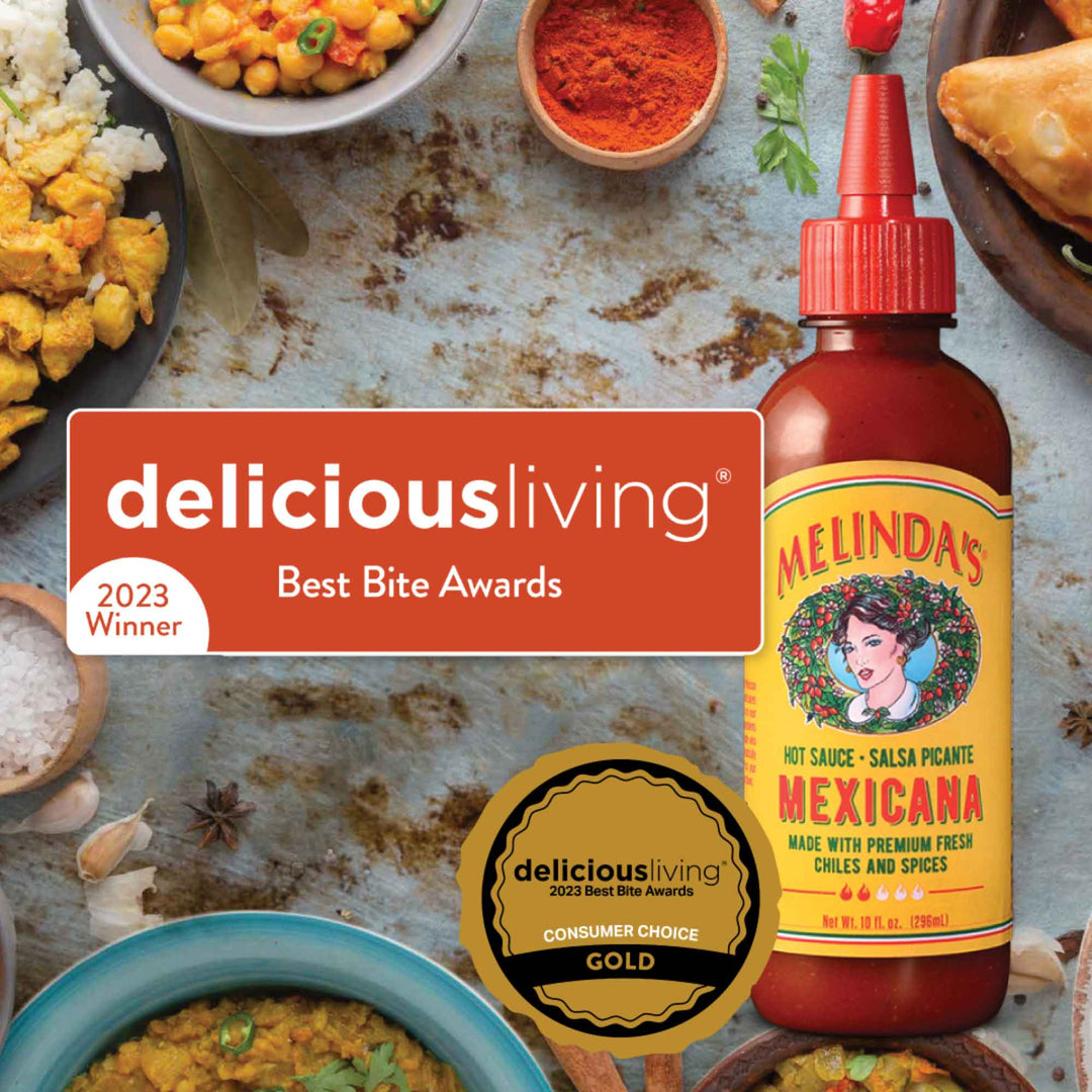 Melinda's Mexicana hot sauce bottle with Delicious Living 2023 Best Bite Awards winner badge and gold medal surrounded by...