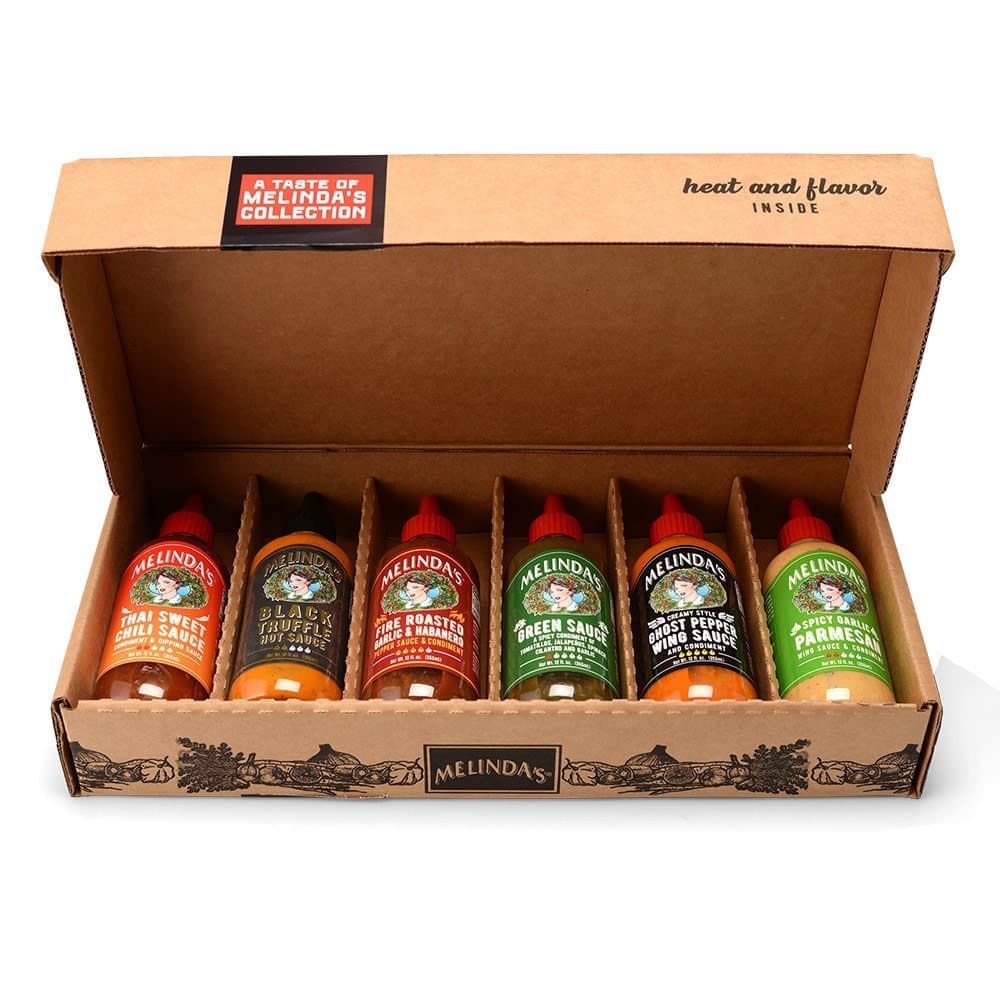 Melinda's hot sauce gift set with six bottles of various flavors in an open cardboard box for Valentine's Day gifting