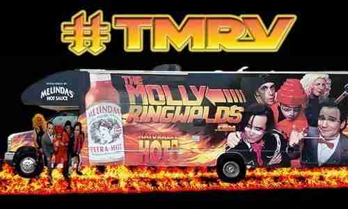 Food truck with "The Molly's Wingfields" branding and hot sauce imagery, featuring flames and promotional graphics
