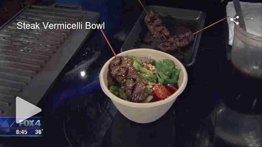 Steak Vermicelli Bowl with grilled meat, greens, and vegetables in white bowl on dark surface during Fox 4 cooking segment