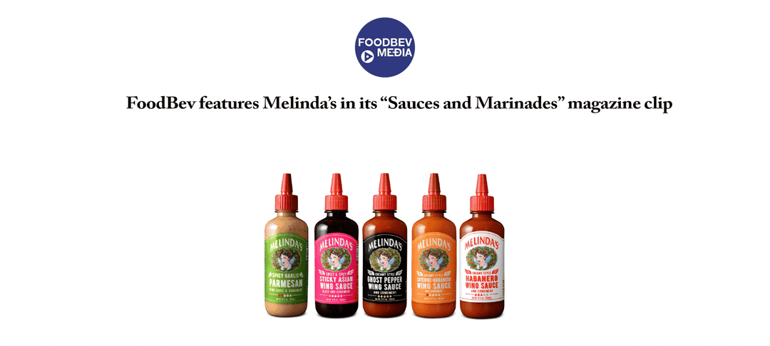 Five bottles of Melinda's sauces and marinades with colorful labels lined up in a row, featuring various flavors...