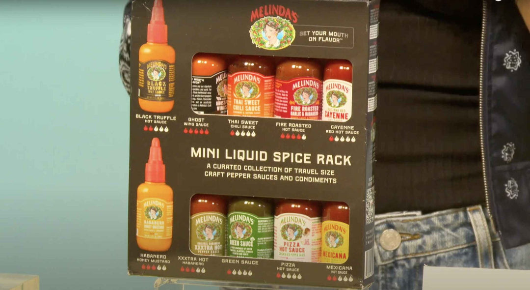 Melinda's Mini Liquid Spice Pack containing 10 travel-size hot sauces with varying heat levels displayed in packaging