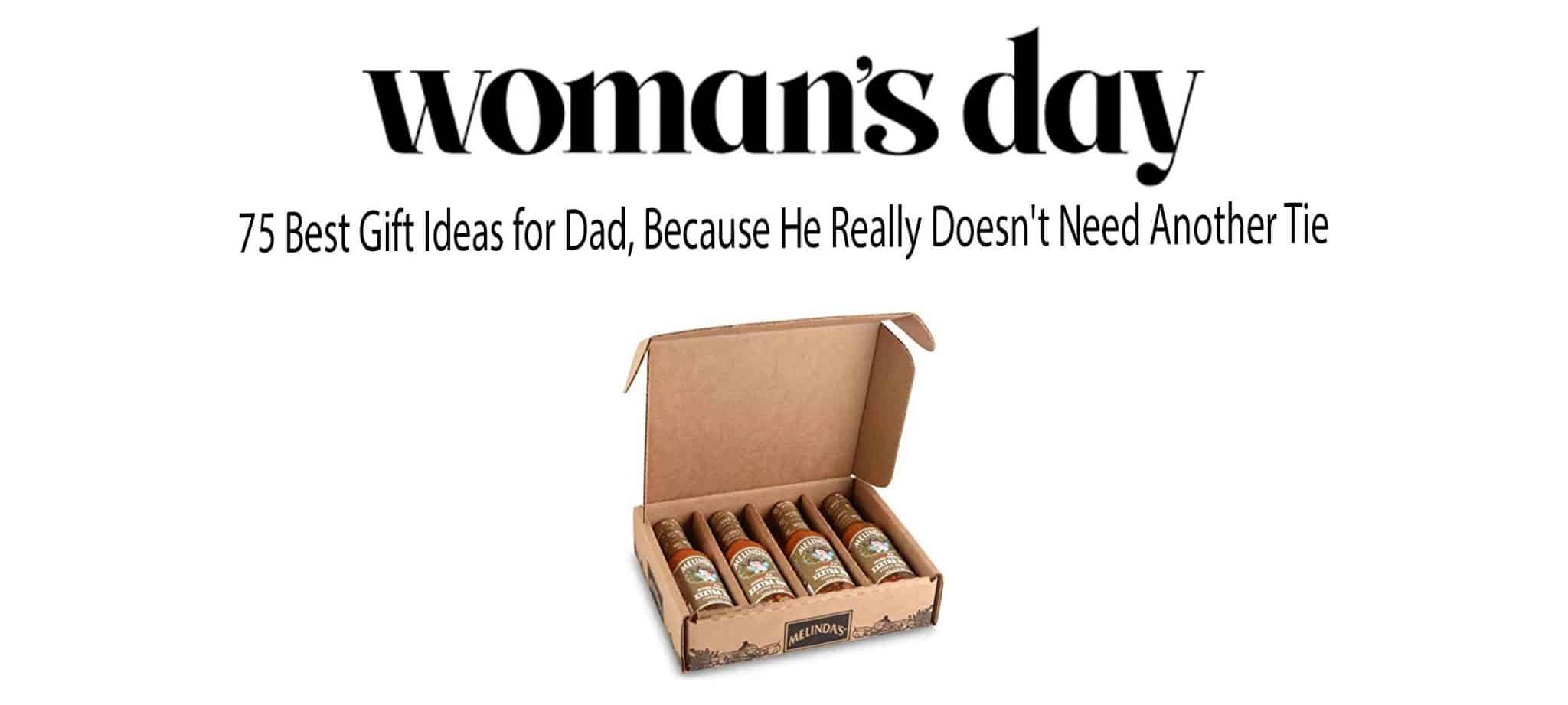 Open cardboard box containing four cigars with decorative bands, representing alternative Father's Day gift ideas