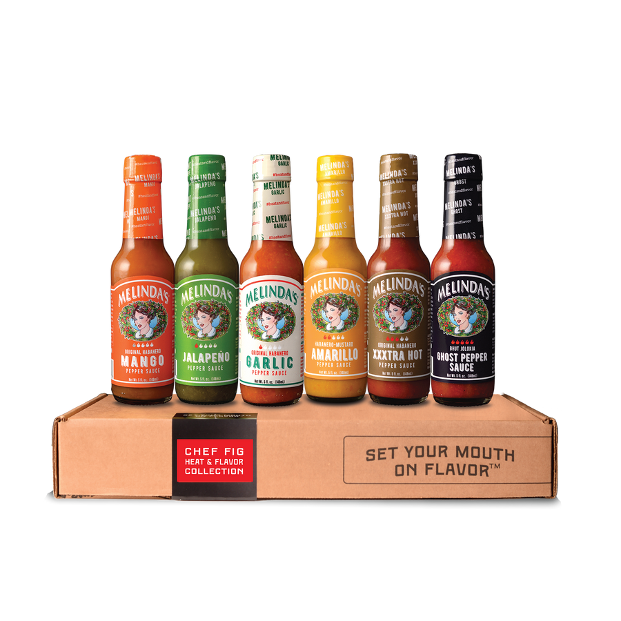 Chef Fig's Heat & Flavor Collection gift box with six 5 oz bottles: Mango, Jalapeño, Garlic, Amarillo, XXXtra Hot, and Ghost Pepper pepper sauces
