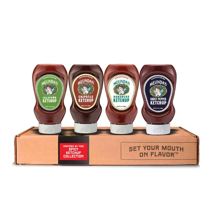 A collection of Melinda's - Inspired by Fire Spicy Ketchup bottles on a cardboard box.