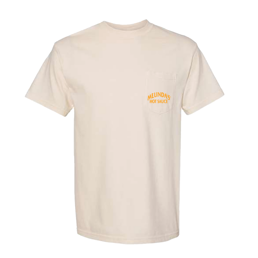 Cream-colored t-shirt with orange "Melinda's Hot Sauce" text on chest pocket area