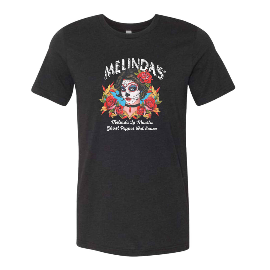 A black t-shirt with a fiery graphic design capturing the essence of Melinda's brand. Spice up your style with Melinda’s La Muerta Bella + Canvas Jersey Tee.