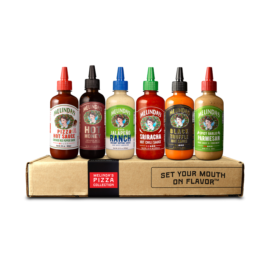 A group of Melinda's Pizza Collection hot sauce bottles on a pizza box, including Melinda’s Pizza Hot Sauce, Hot Honey, Jalapeño Ranch, Sriracha Hot Chili Sauce, Black Truffle Hot Sauce, and Spicy Garlic Parmesan. Elevate your pizza game with these flavor-packed delights!