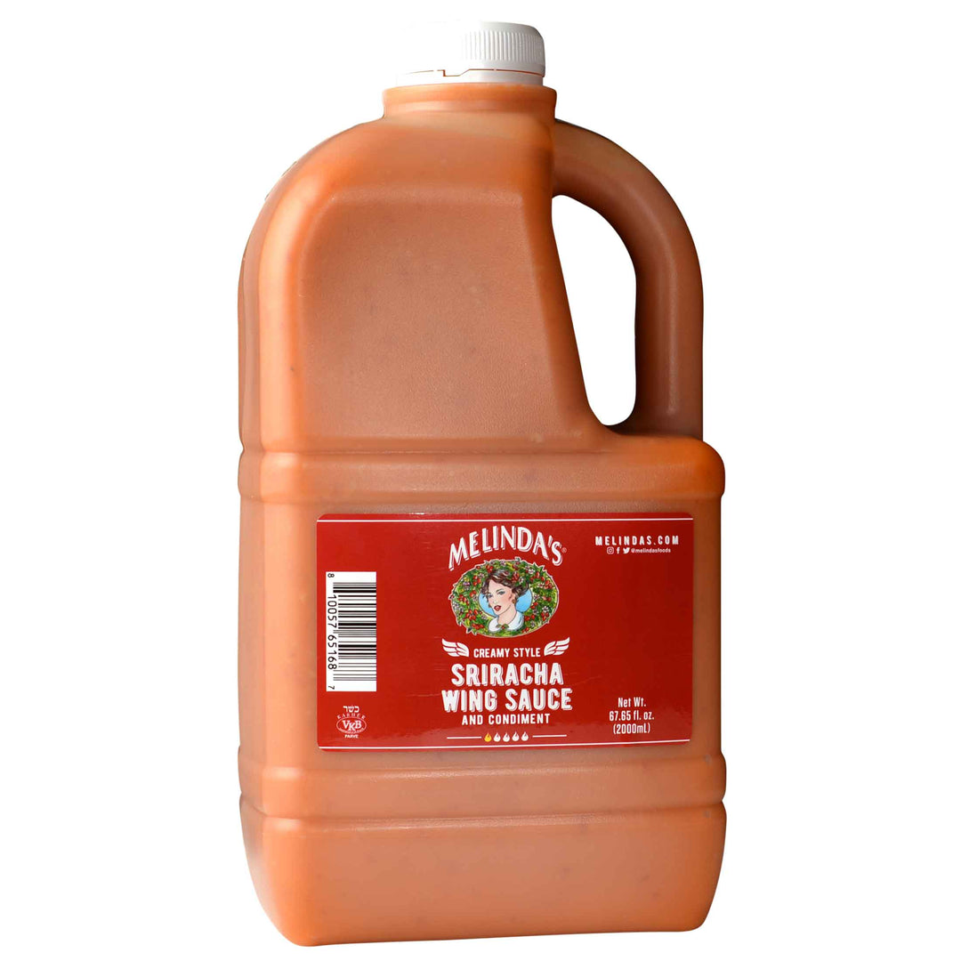 A jug of Melinda's Sriracha Wing Sauce Half Gallon, the everything Asian sauce for wings. Made with fermented ripe red jalapenos & garlic for a true umami bomb. Enjoy on wings, chicken, shrimp, wraps, sandwiches, and more.
