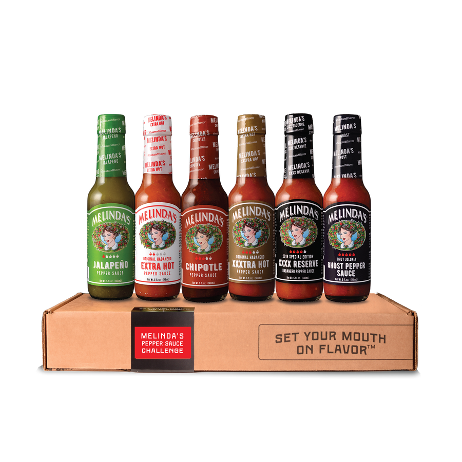 Melinda's Pepper Sauce Challenge Collection gift box with six 5 oz bottles: Jalapeño, Extra Hot, Chipotle, XXXtra Hot, XXXX Reserve, and Ghost Pepper pepper sauces