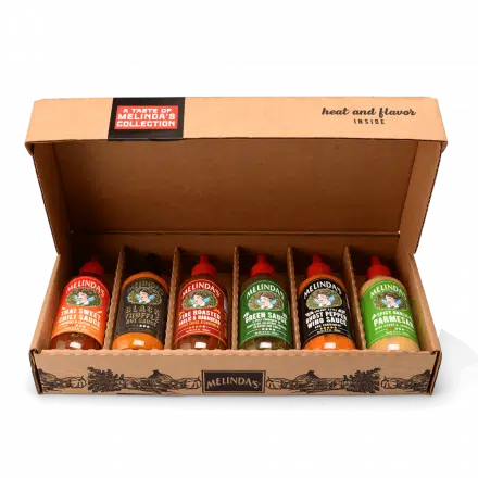 A box containing Melinda's Sauce - A Taste of Melinda's Collection - Set Your Mouth on Flavor.